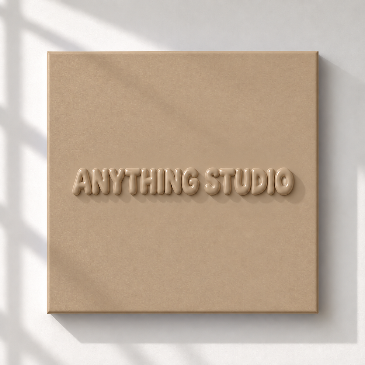ANYTHING STUDIO sculptural lettering canvas in beige on a white wall