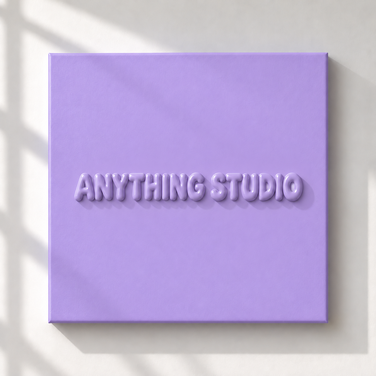 ANYTHING STUDIO sculptural lettering canvas in lavender on a white wall