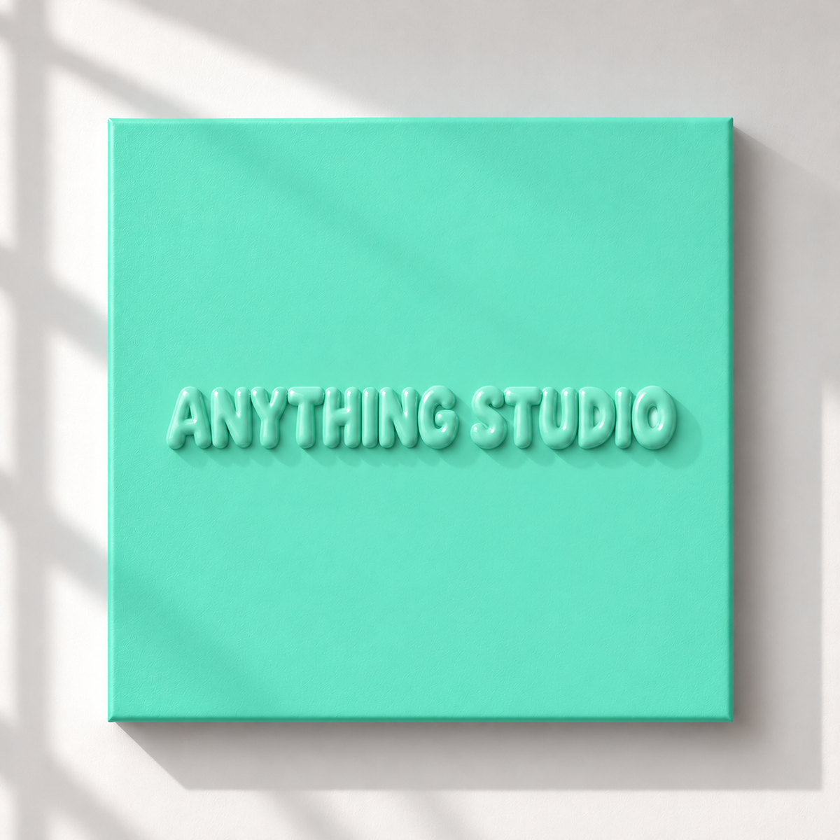 ANYTHING STUDIO sculptural lettering canvas in mint green on a white wall
