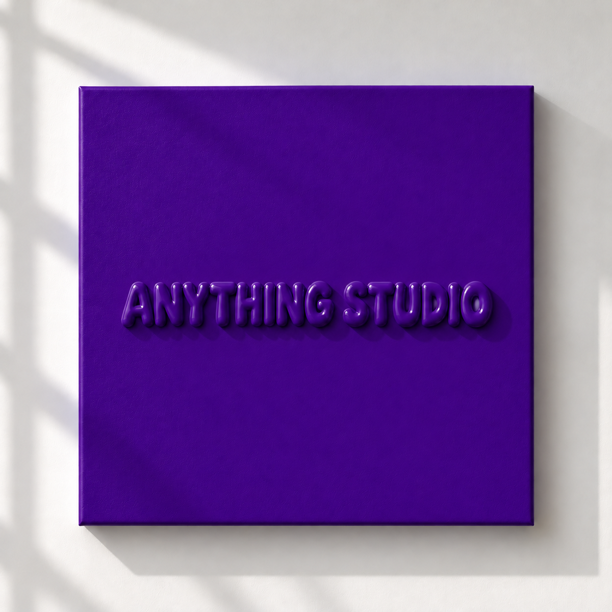ANYTHING STUDIO sculptural lettering canvas in purple on a white wall