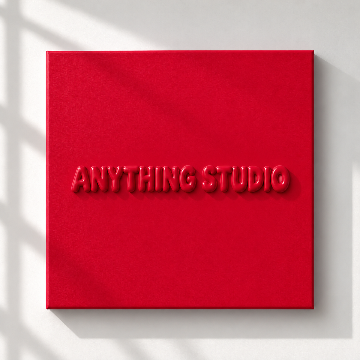 ANYTHING STUDIO sculptural lettering canvas in red on a white wall